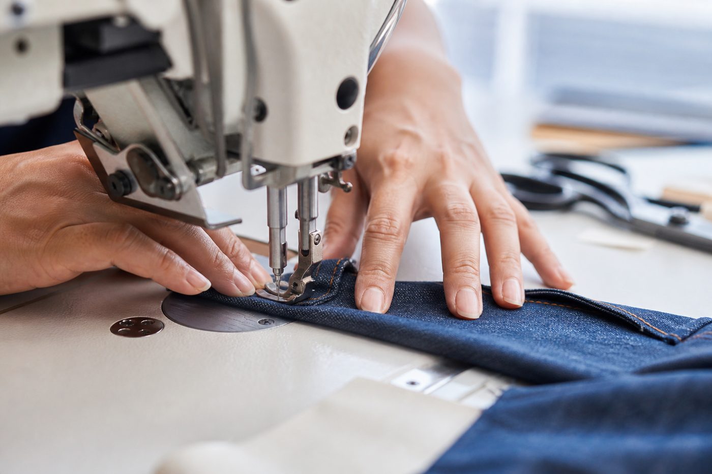 Denim being tailored and stitched